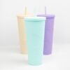 a group of colorful plastic cups with straws